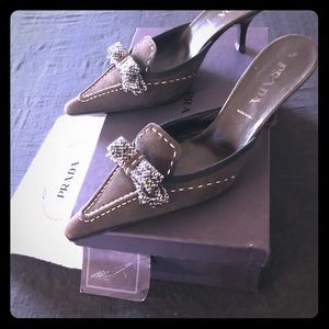 PRADA brown leather mules with tweed bow accent